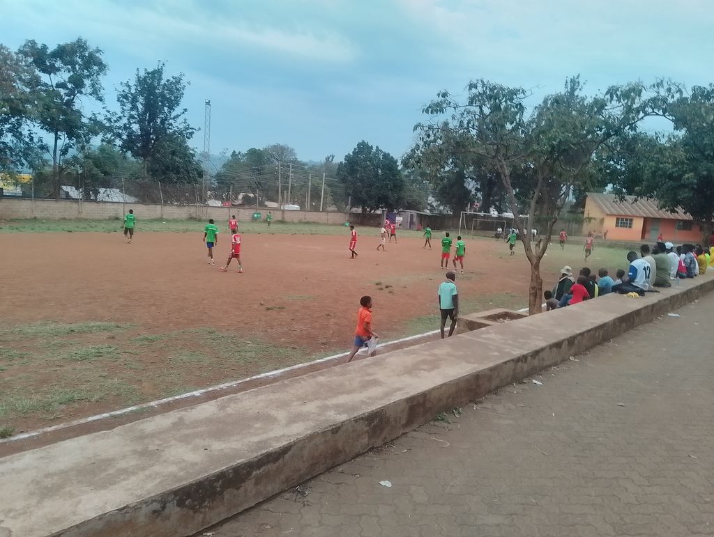 Spectators seated along the pitch watching a match at the Inter-Masjid Football Tournament in Kisumu.